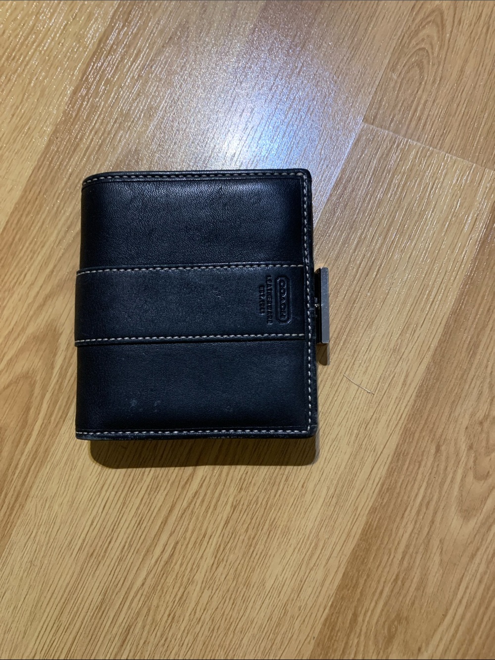 Vintage Coach Coin Wallet in black leather with kiss clasp and embossed brand